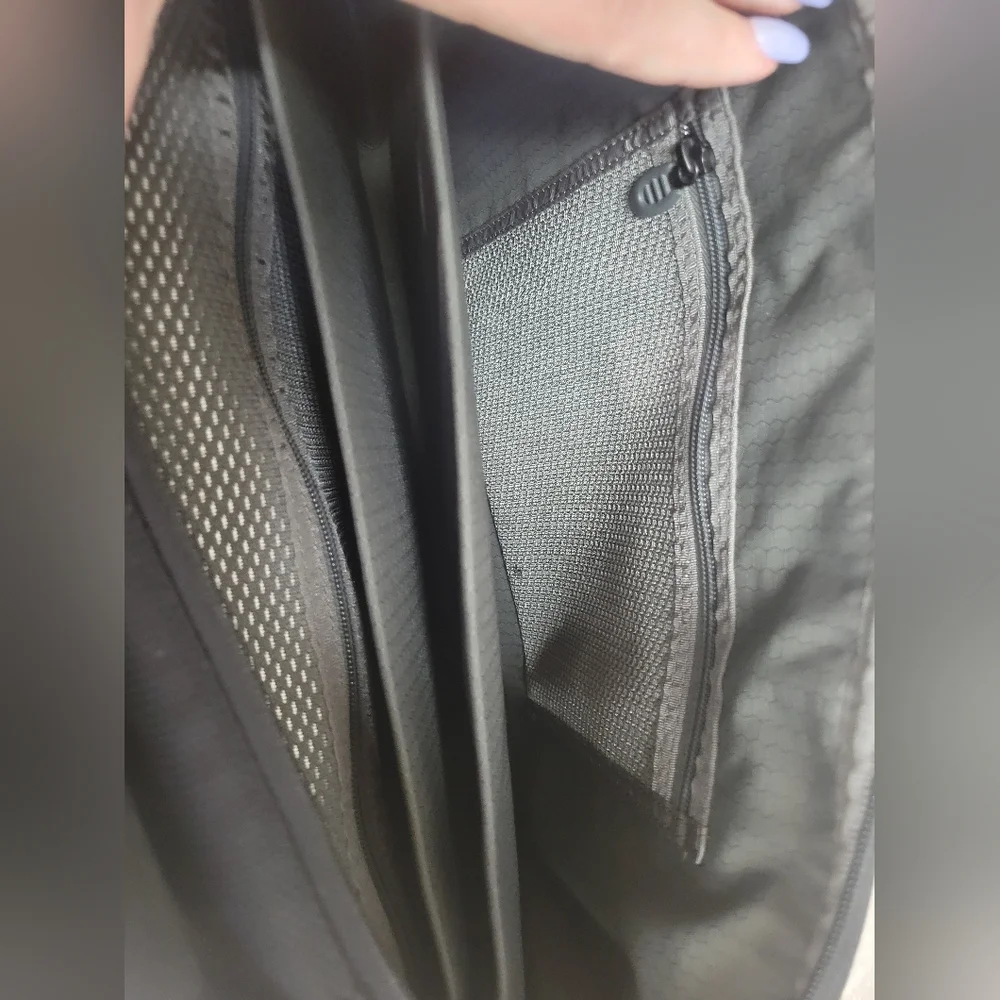 TUMI Black Backpack with Padded Straps and Multiple Compartments